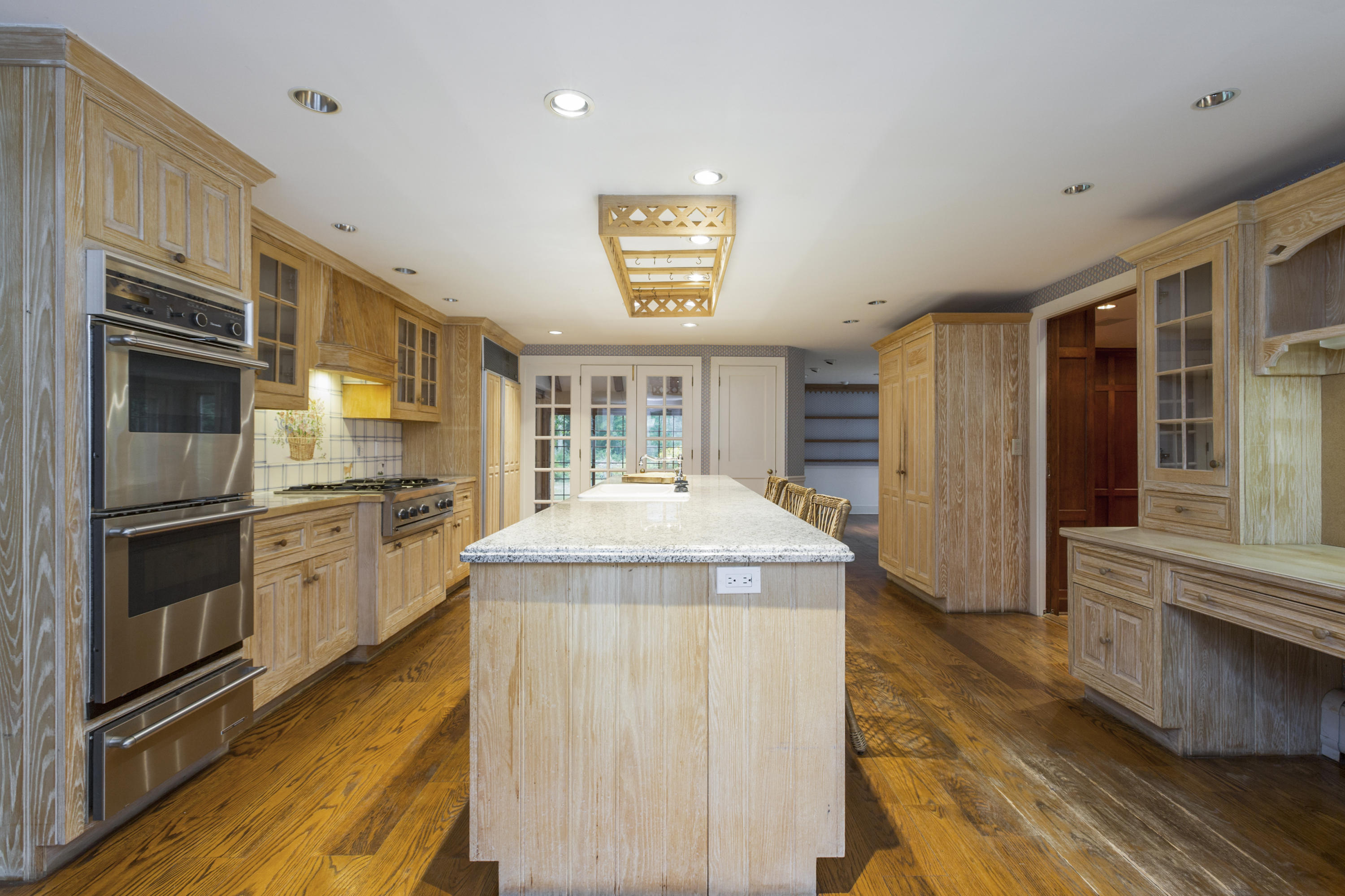 283 Hollow Tree Ridge Road Darien, CT 06820 - Photo 12 of 49 a kitchen with a sink stove and refrigerator