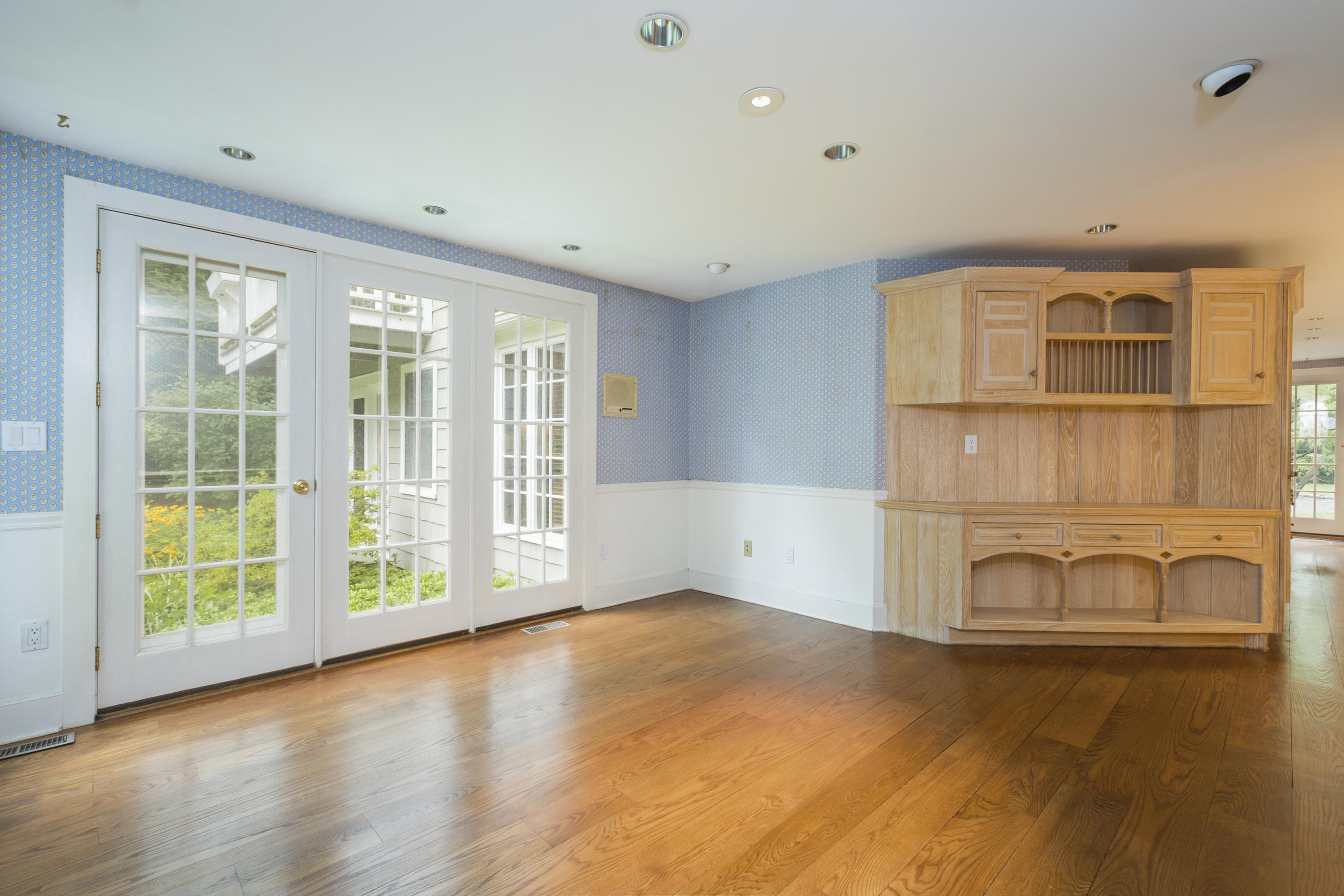 283 Hollow Tree Ridge Road Darien, CT 06820 - Photo 13 of 49 a view of an empty room with wooden floor and a window
