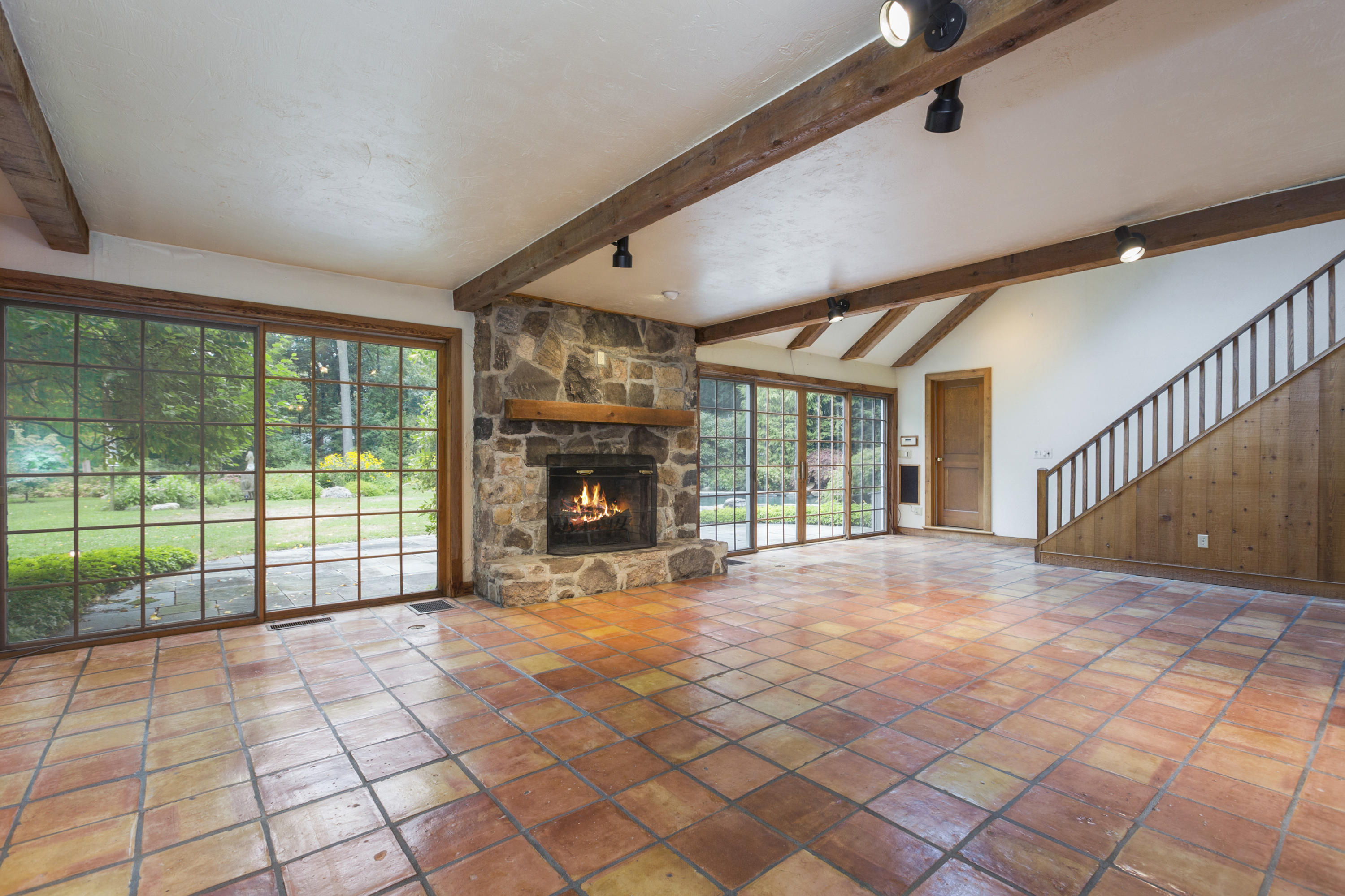 283 Hollow Tree Ridge Road Darien, CT 06820 - Photo 15 of 49 a view of an empty room with windows