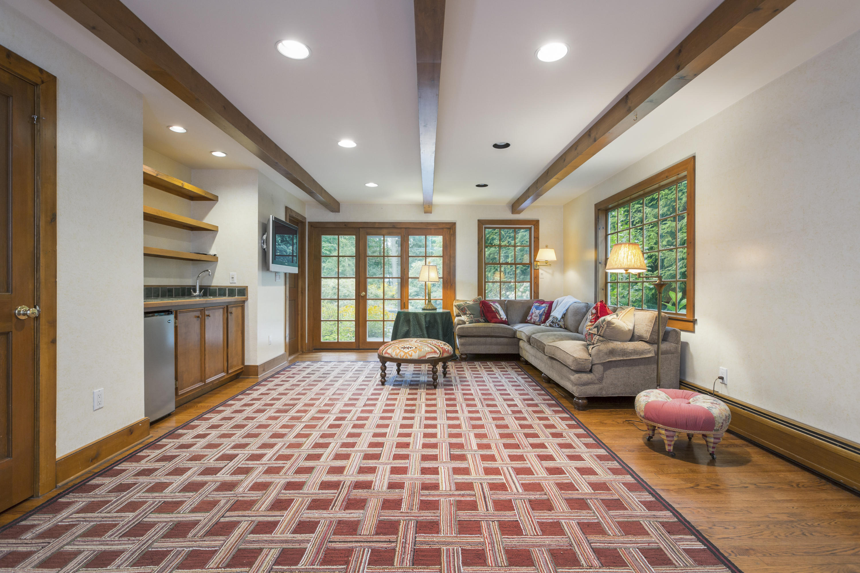 283 Hollow Tree Ridge Road Darien, CT 06820 - Photo 18 of 49 a living room with furniture and a rug