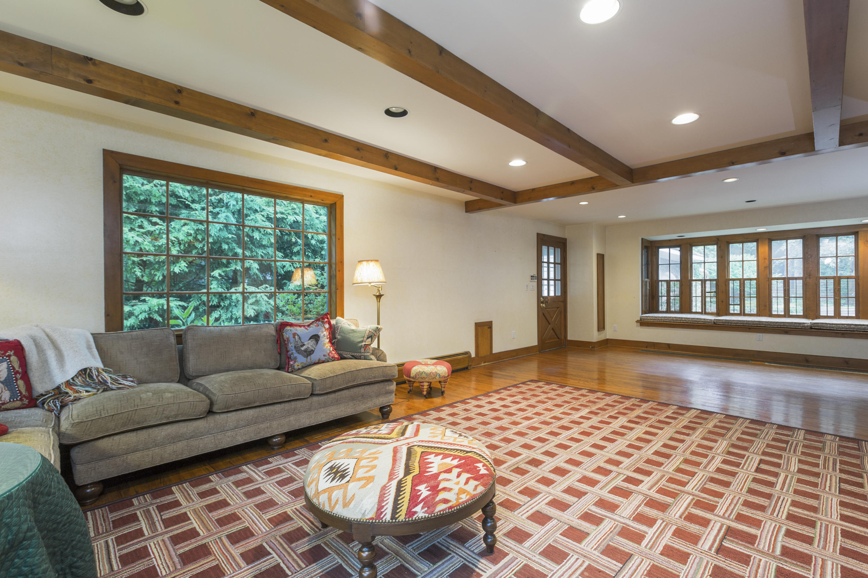 283 Hollow Tree Ridge Road Darien, CT 06820 - Photo 19 of 49 a living room with furniture and a large window