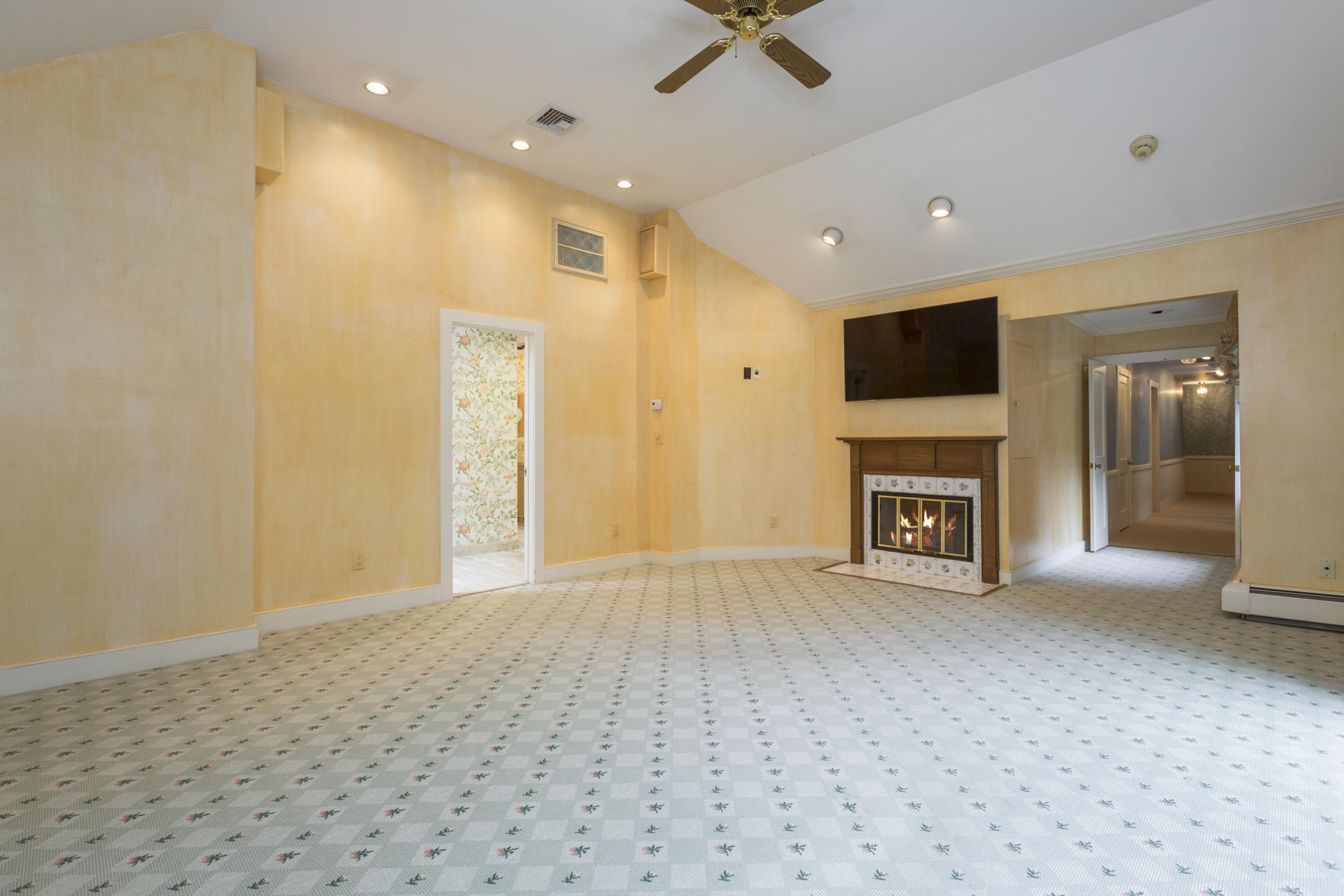 283 Hollow Tree Ridge Road Darien, CT 06820 - Photo 24 of 49 a view of empty room with a fireplace