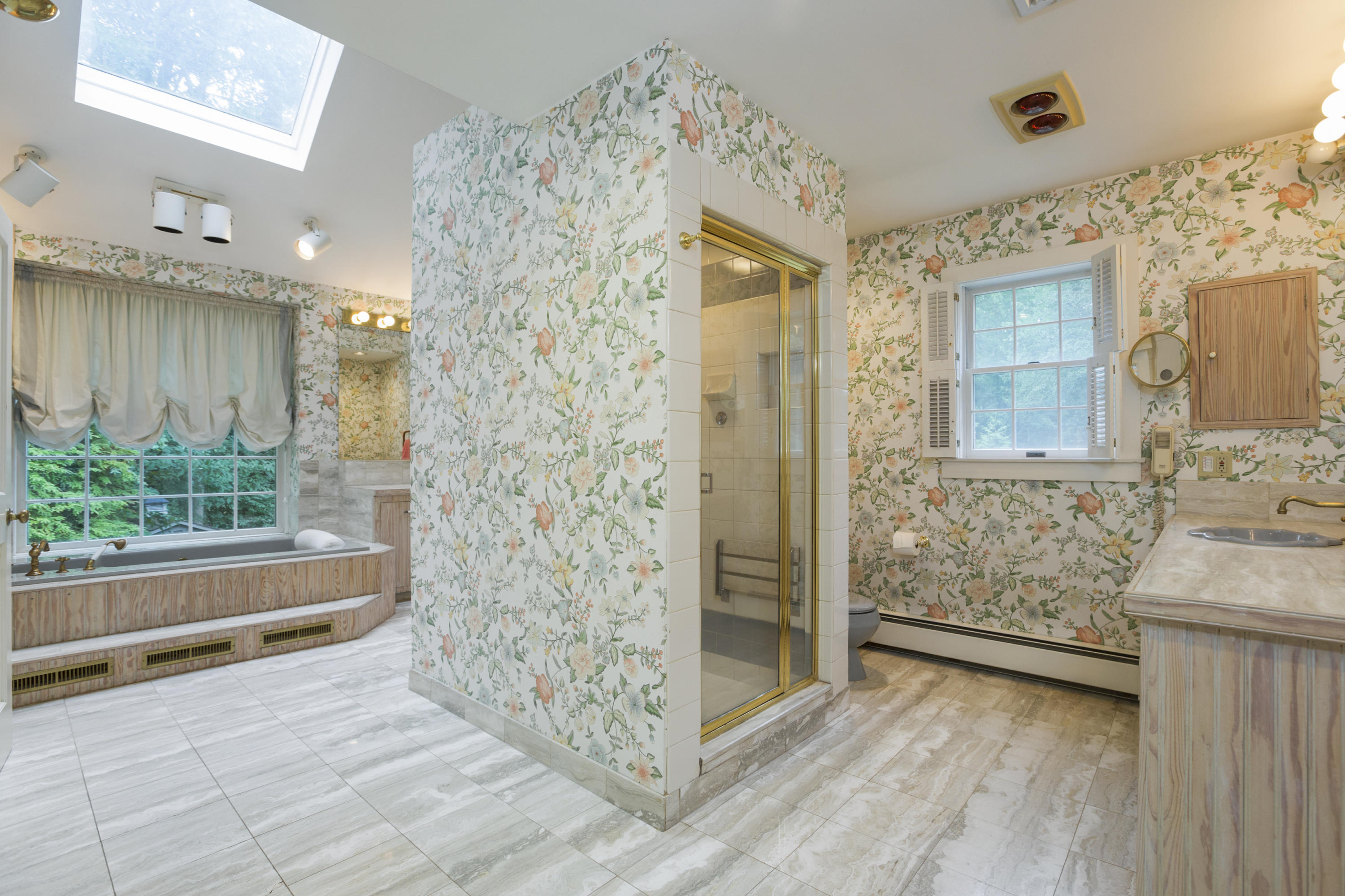 283 Hollow Tree Ridge Road Darien, CT 06820 - Photo 26 of 49 a bathroom with a bathtub and shower