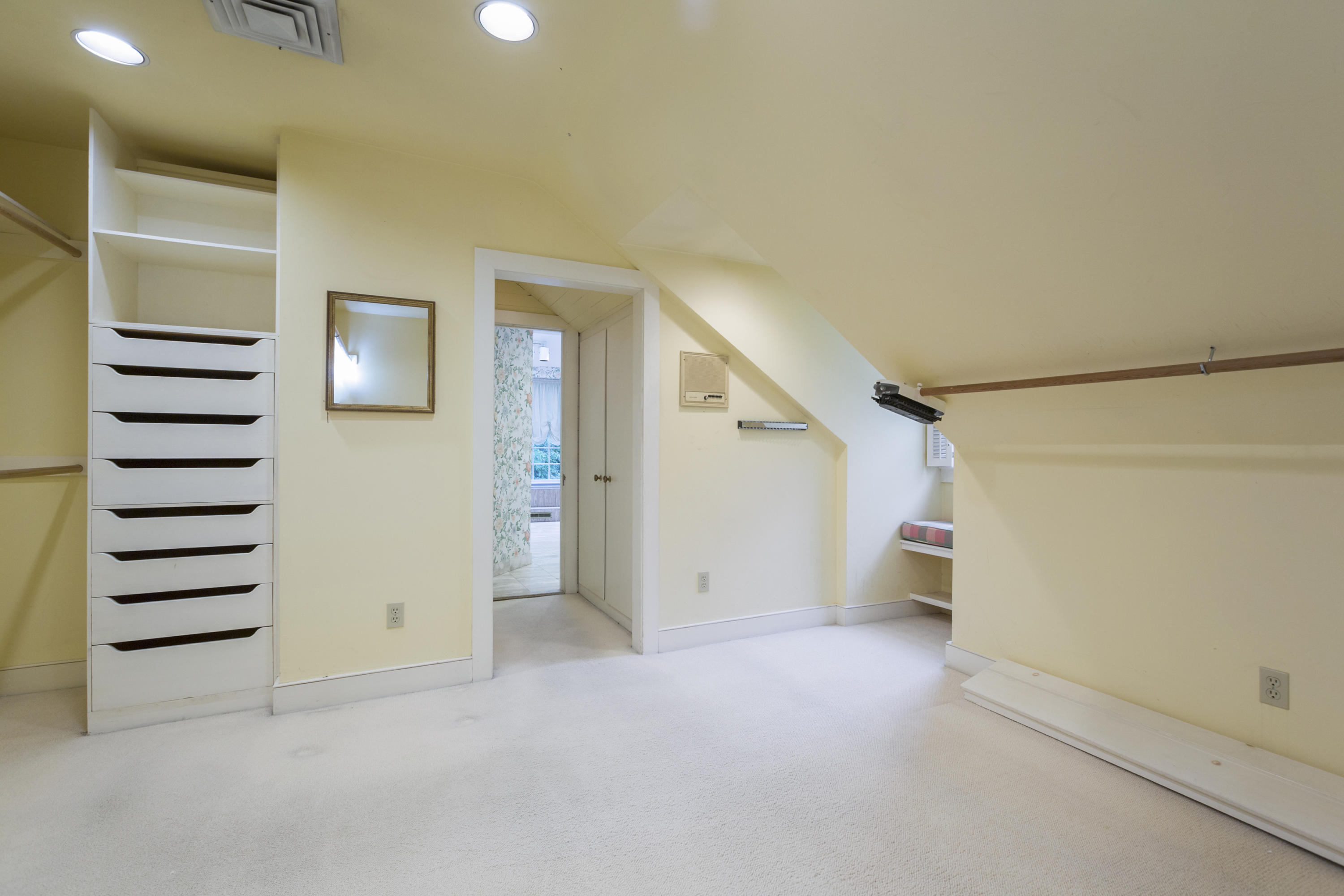 283 Hollow Tree Ridge Road Darien, CT 06820 - Photo 27 of 49 an empty room with a hallway and stairs