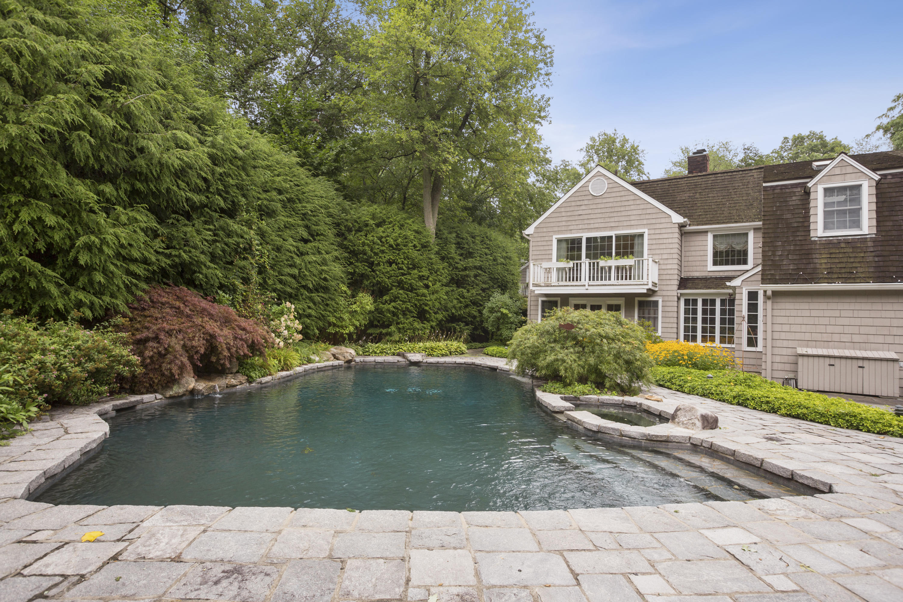 283 Hollow Tree Ridge Road Darien, CT 06820 - Photo 39 of 49 a house with swimming pool in front of it