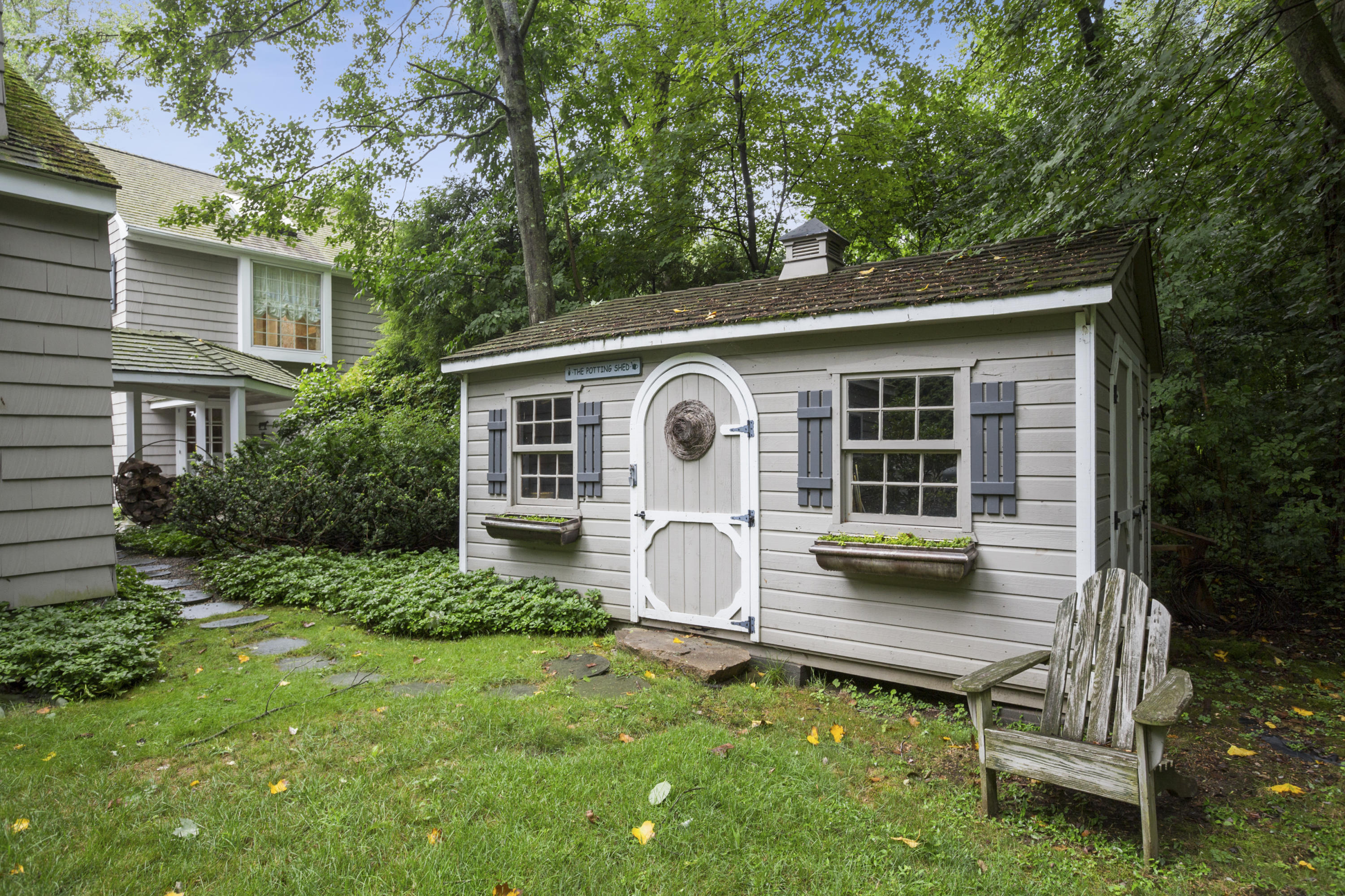 283 Hollow Tree Ridge Road Darien, CT 06820 - Photo 42 of 49 a front view of house with backyard and outdoor seating
