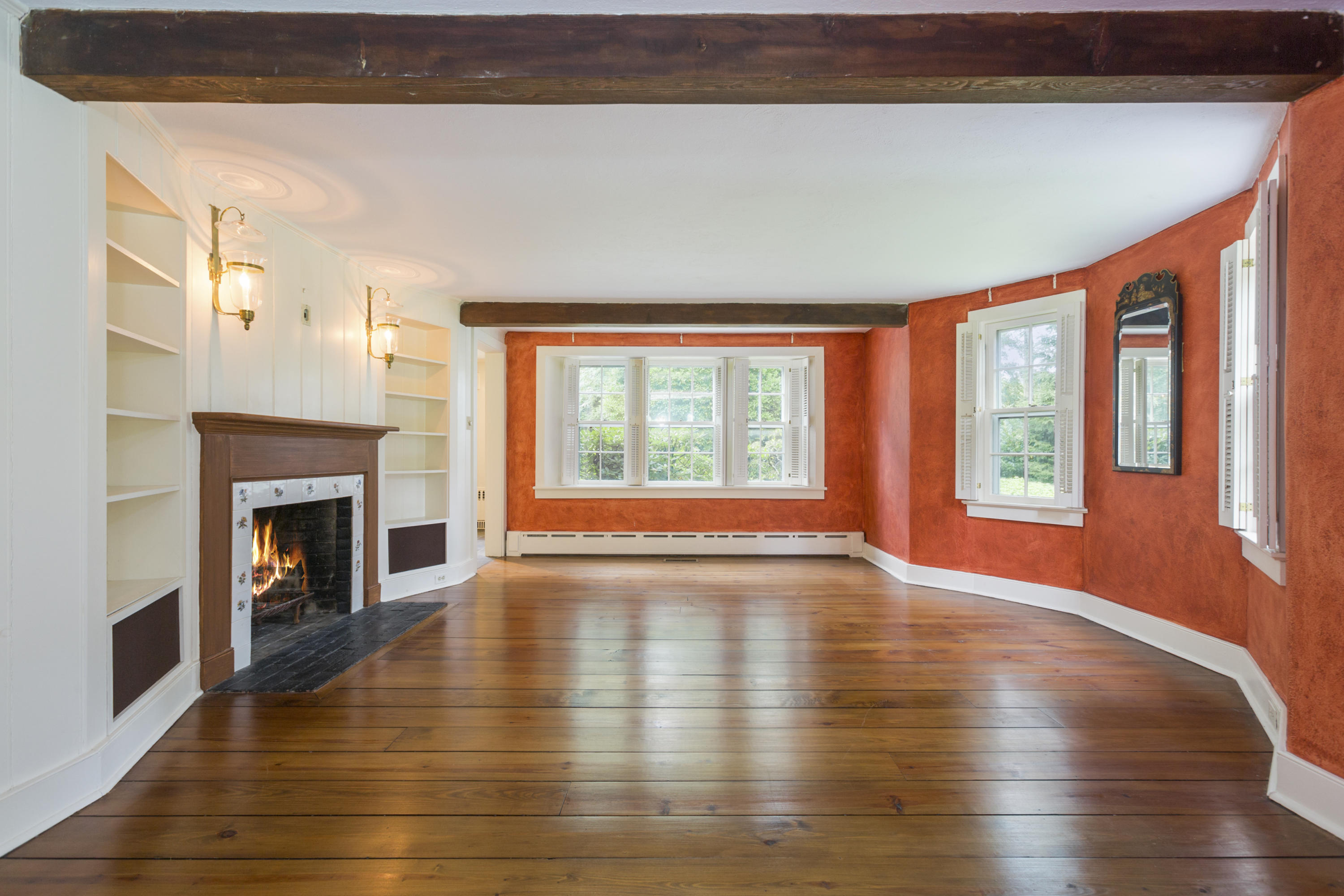283 Hollow Tree Ridge Road Darien, CT 06820 - Photo 6 of 49 a view of an empty room with window and wooden floor