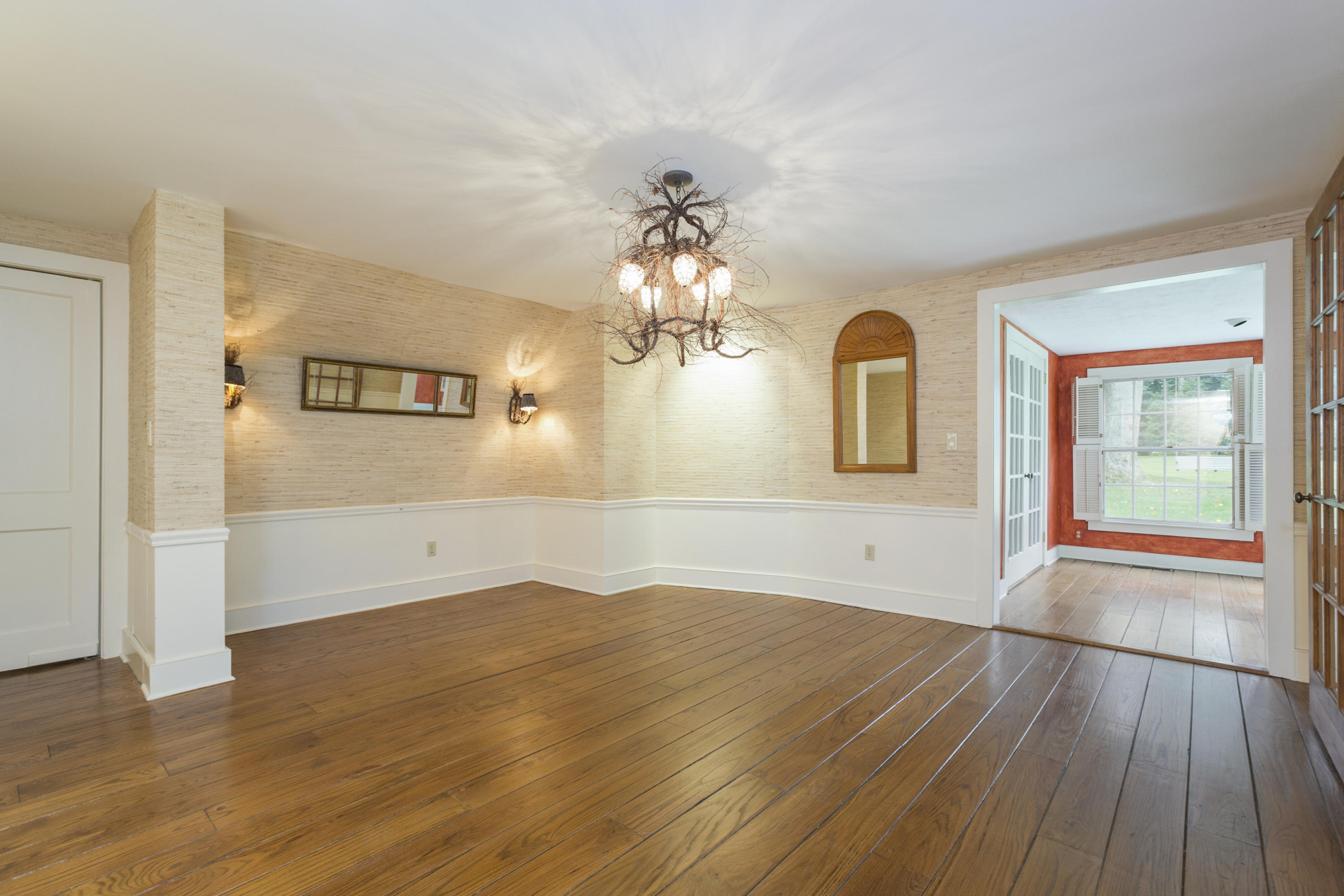 283 Hollow Tree Ridge Road Darien, CT 06820 - Photo 9 of 49 wooden floor in an empty room with a window