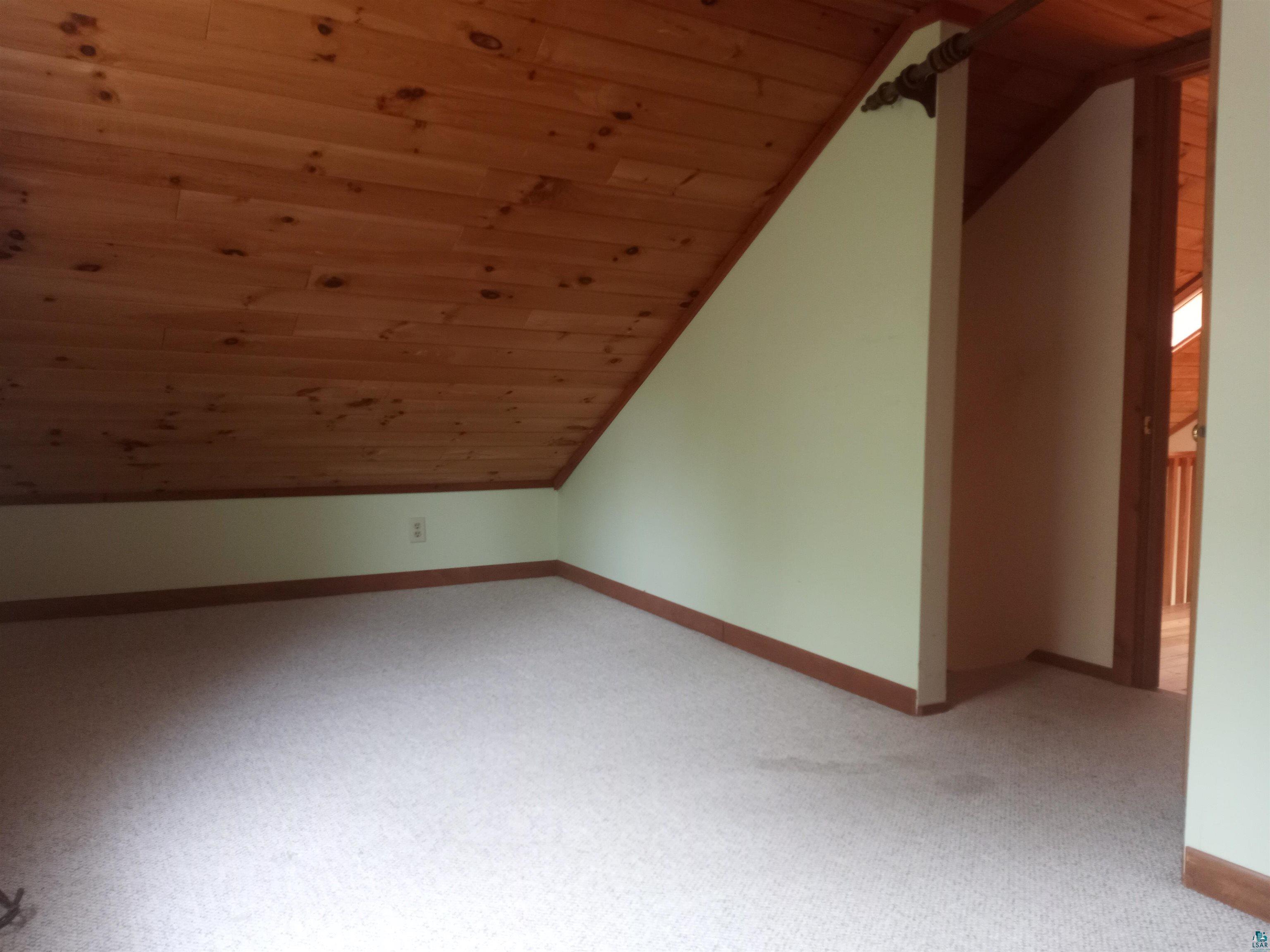 22715 Elm Street Cornucopia, WI 54827 - Photo 19 of 23 Small upstairs bedroom
