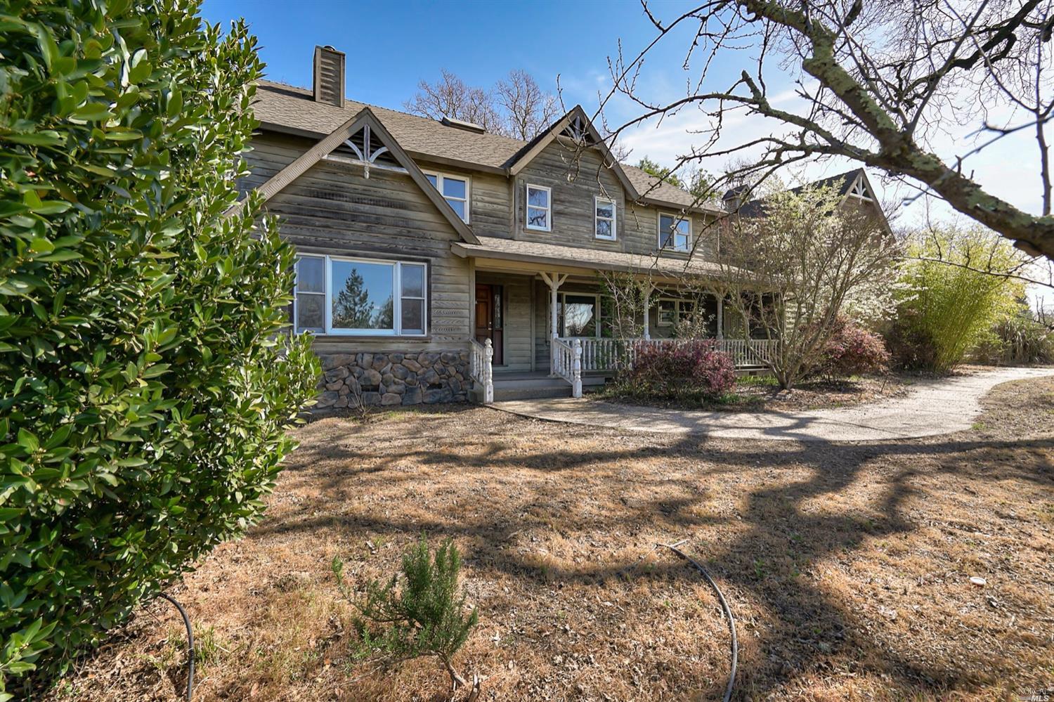 1484 Olivet Road Santa Rosa, CA 95401 - Photo 1 of 1 a front view of a house with a garden