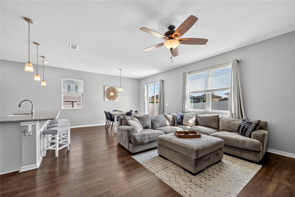 4368 Moon Shadow Loop Mulberry, FL 33860 - Photo 14 of 39 a living room with furniture and wooden floor