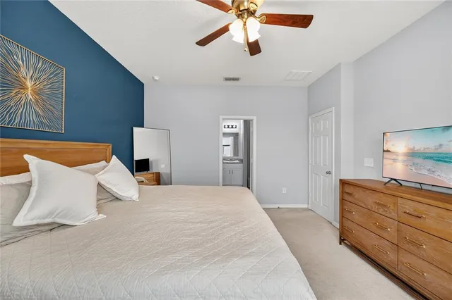 a bedroom with a bed and a dresser