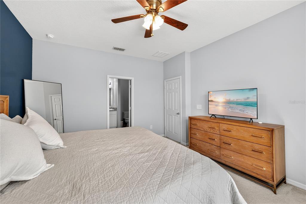 4368 Moon Shadow Loop Mulberry, FL 33860 - Photo 19 of 39 a bedroom with a bed and a dresser