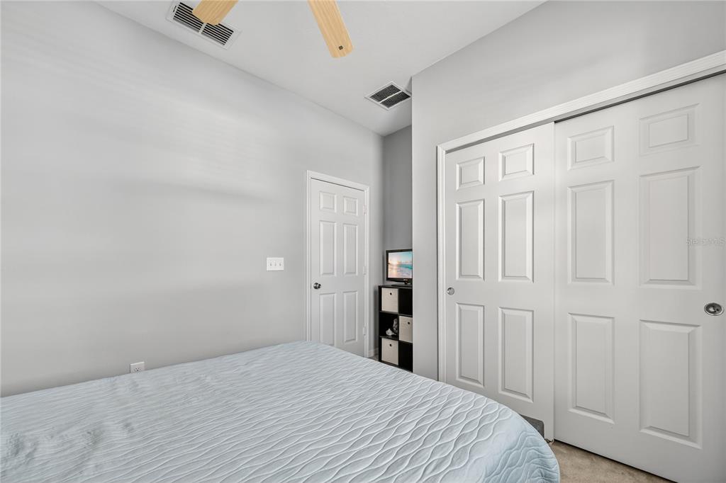4368 Moon Shadow Loop Mulberry, FL 33860 - Photo 30 of 39 a view of a bedroom with wooden floor and closet