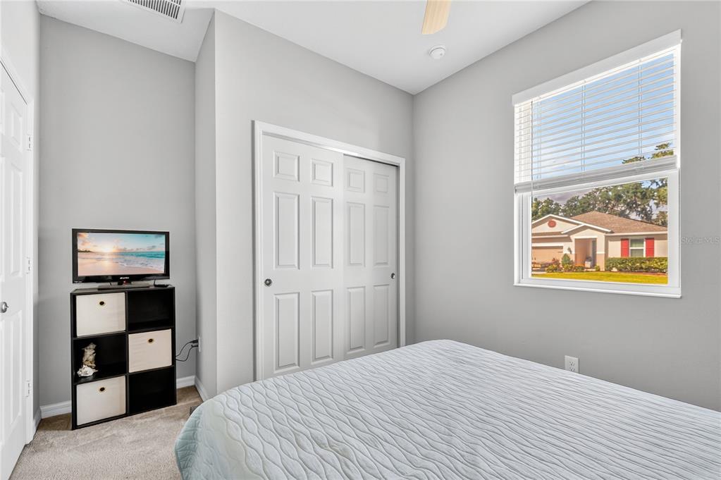 4368 Moon Shadow Loop Mulberry, FL 33860 - Photo 31 of 39 a bedroom with a bed and a window