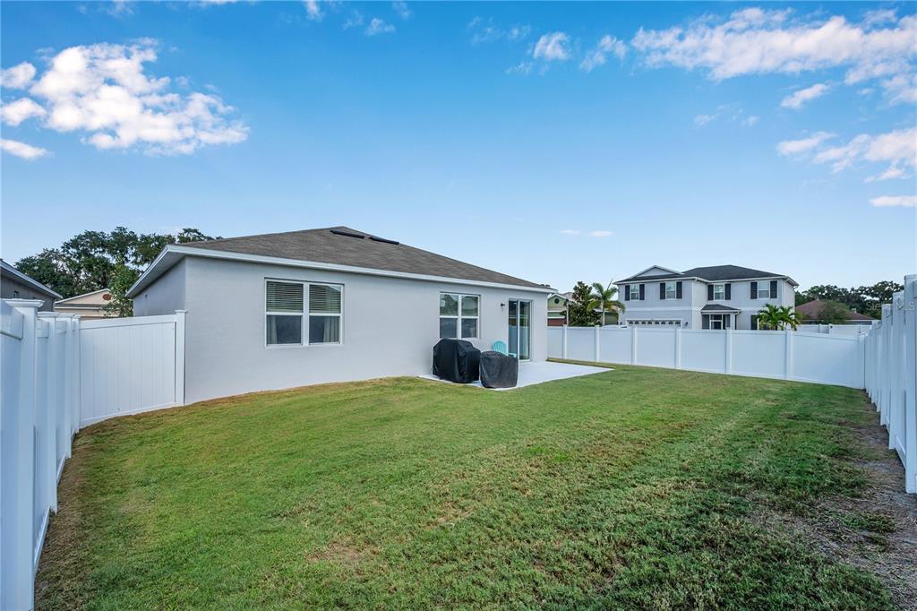 4368 Moon Shadow Loop Mulberry, FL 33860 - Photo 36 of 39 a view of a house with a yard and potted plants