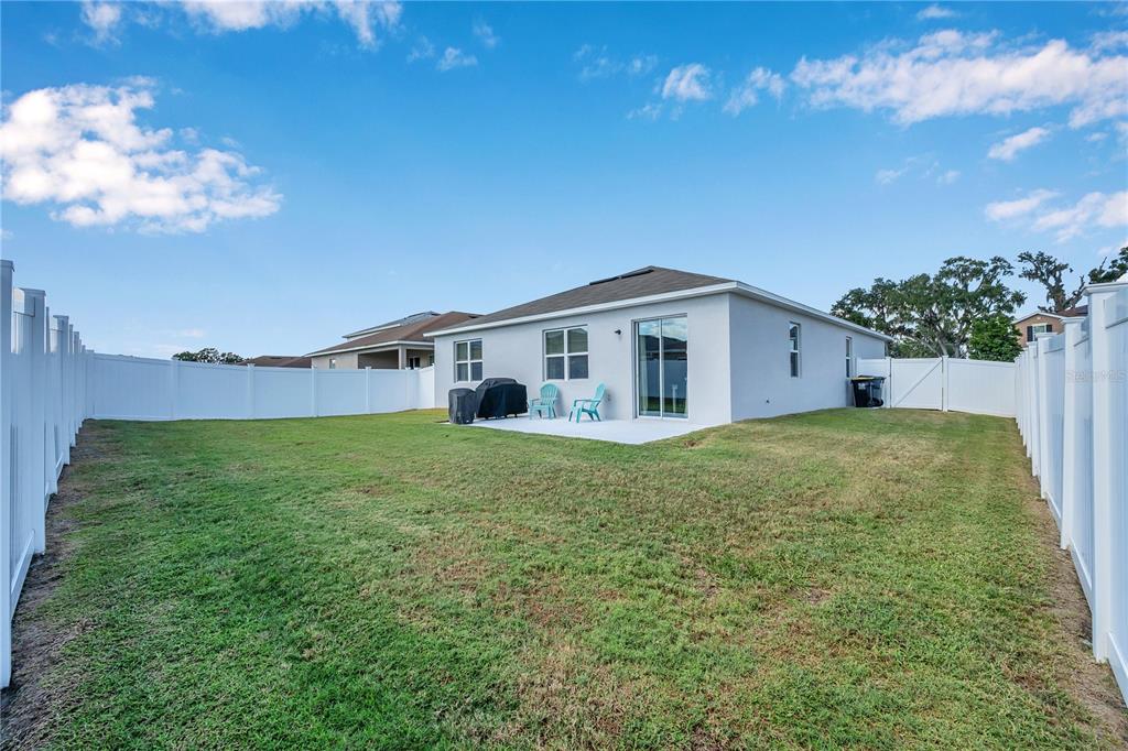 4368 Moon Shadow Loop Mulberry, FL 33860 - Photo 38 of 39 a house view with a garden space