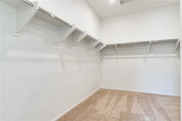 a view of an empty walk in closet