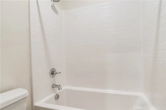 a bathroom with a shower and a bathtub