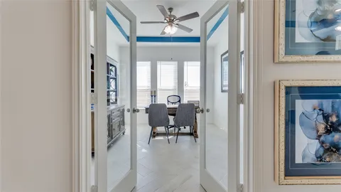 a kitchen with sink refrigerator and large window