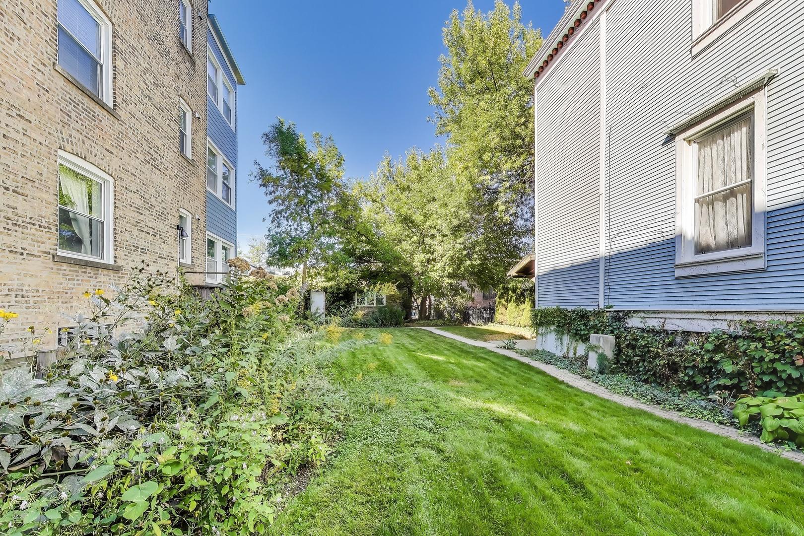2524 West Winnemac Avenue Chicago, IL 60625 - Photo 3 of 16 a view of a house with a yard