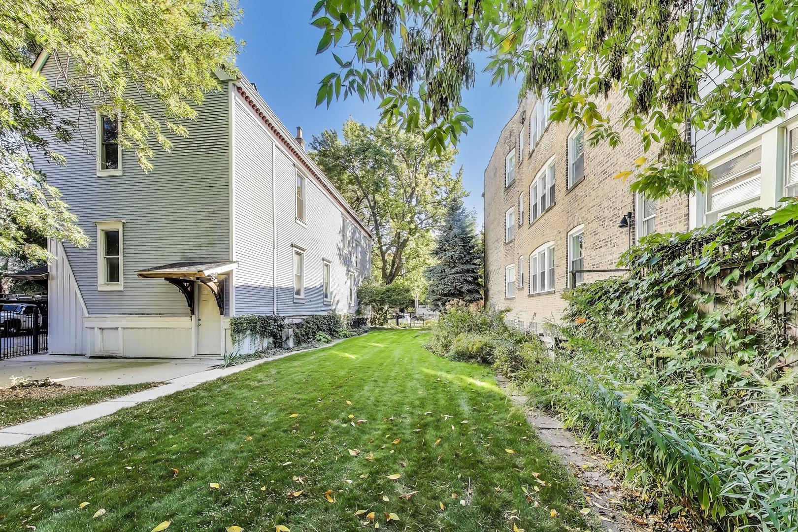 2524 West Winnemac Avenue Chicago, IL 60625 - Photo 4 of 16 a view of backyard of house with outdoor seating and green space