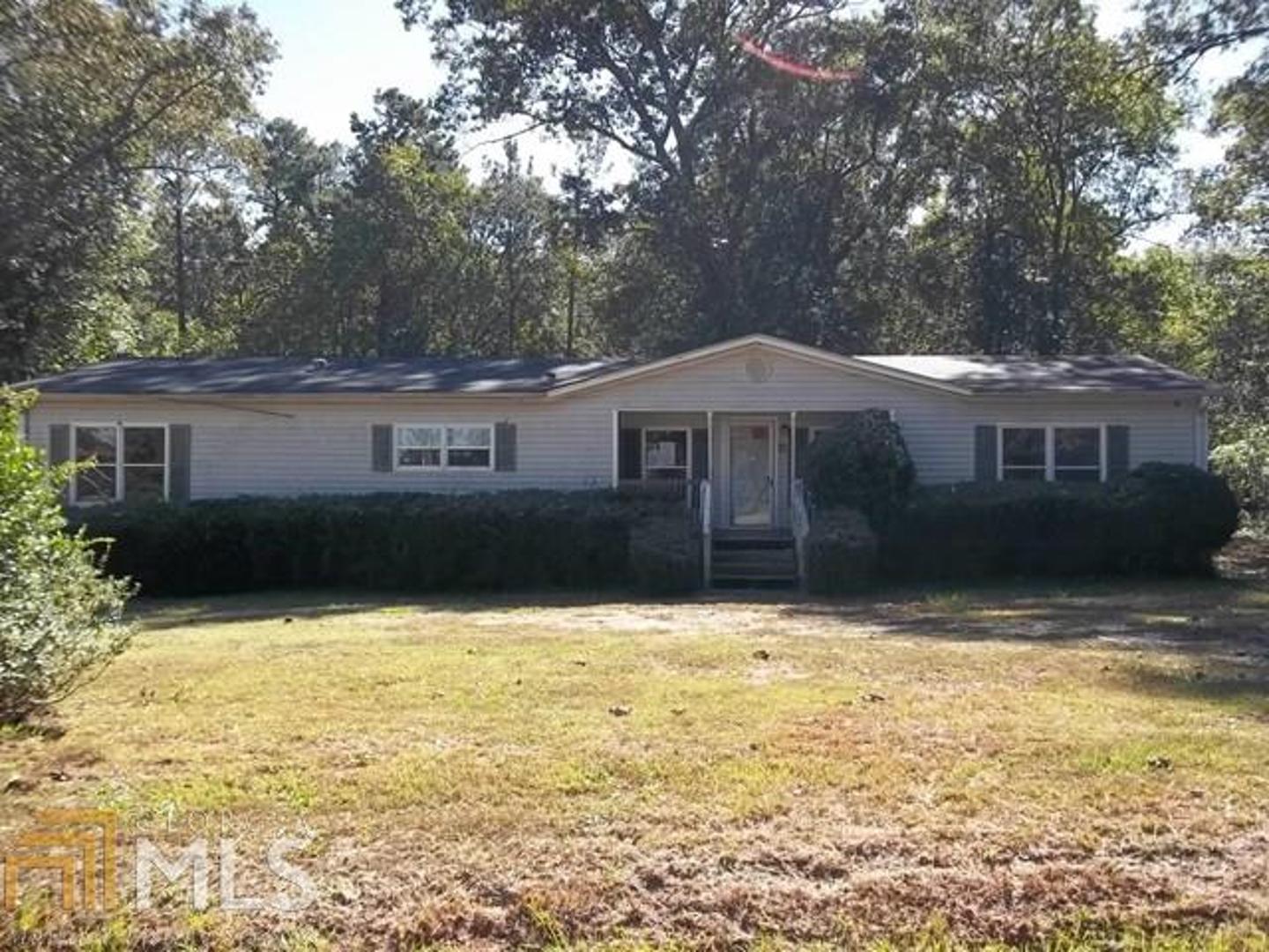 34 Tanners Bridge Road Bethlehem, GA 30620 - Photo 1 of 1 a house with trees in front of it