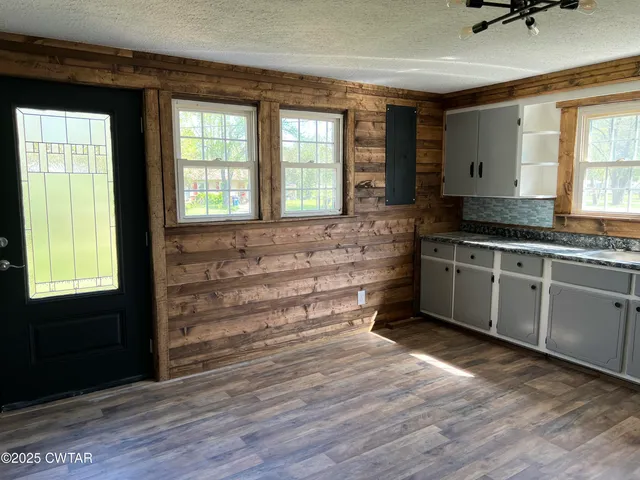 a spacious bathroom with a double vanity sink and a bathtub