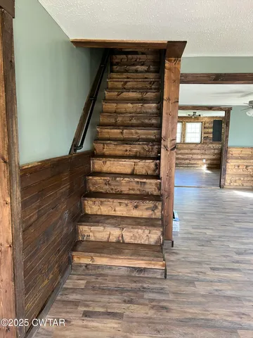 a view of entryway with wooden floor