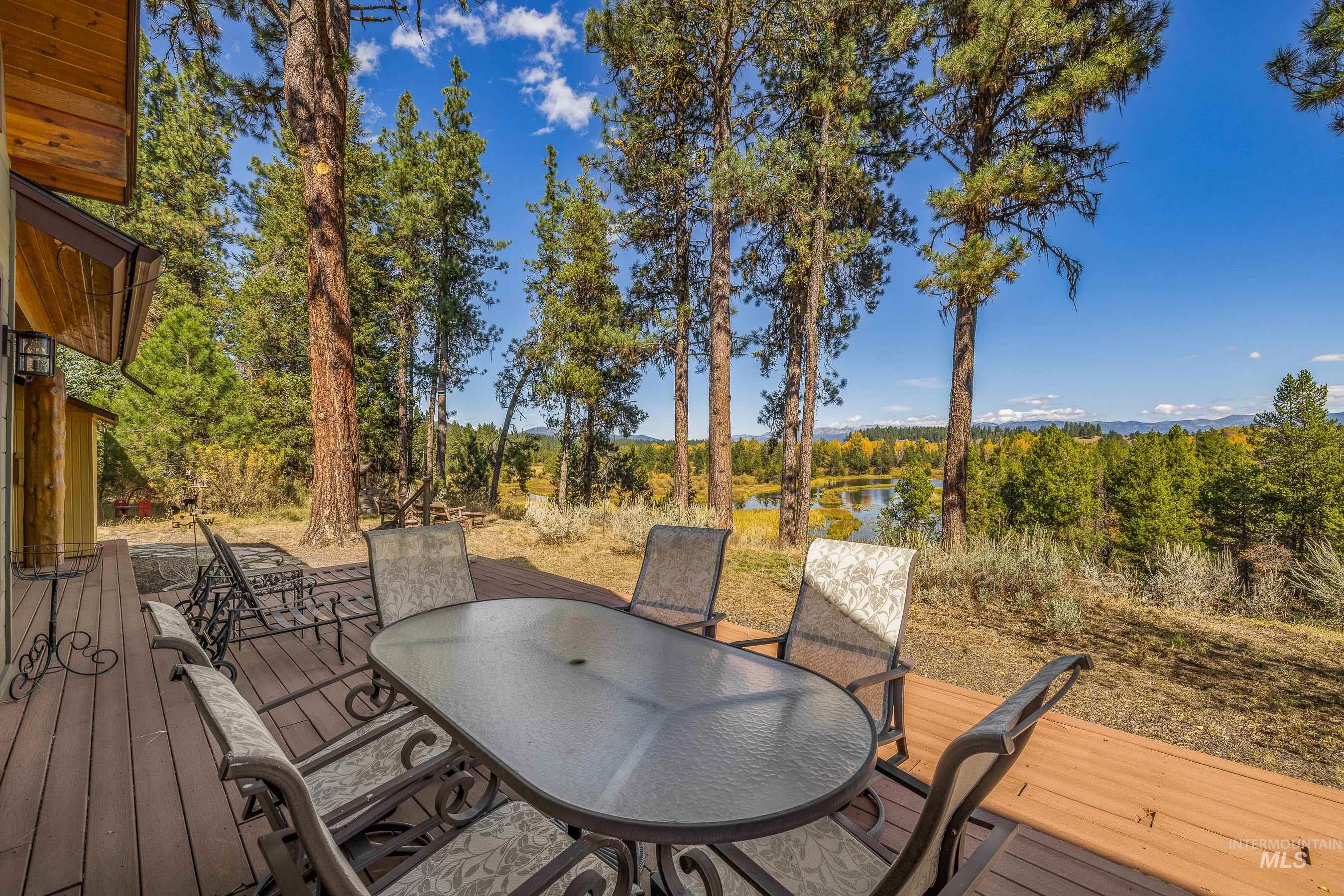 8 Bitterroot Court McCall, ID 83638 - Photo 40 of 50 Wooden terrace with a water view and outdoor dining space