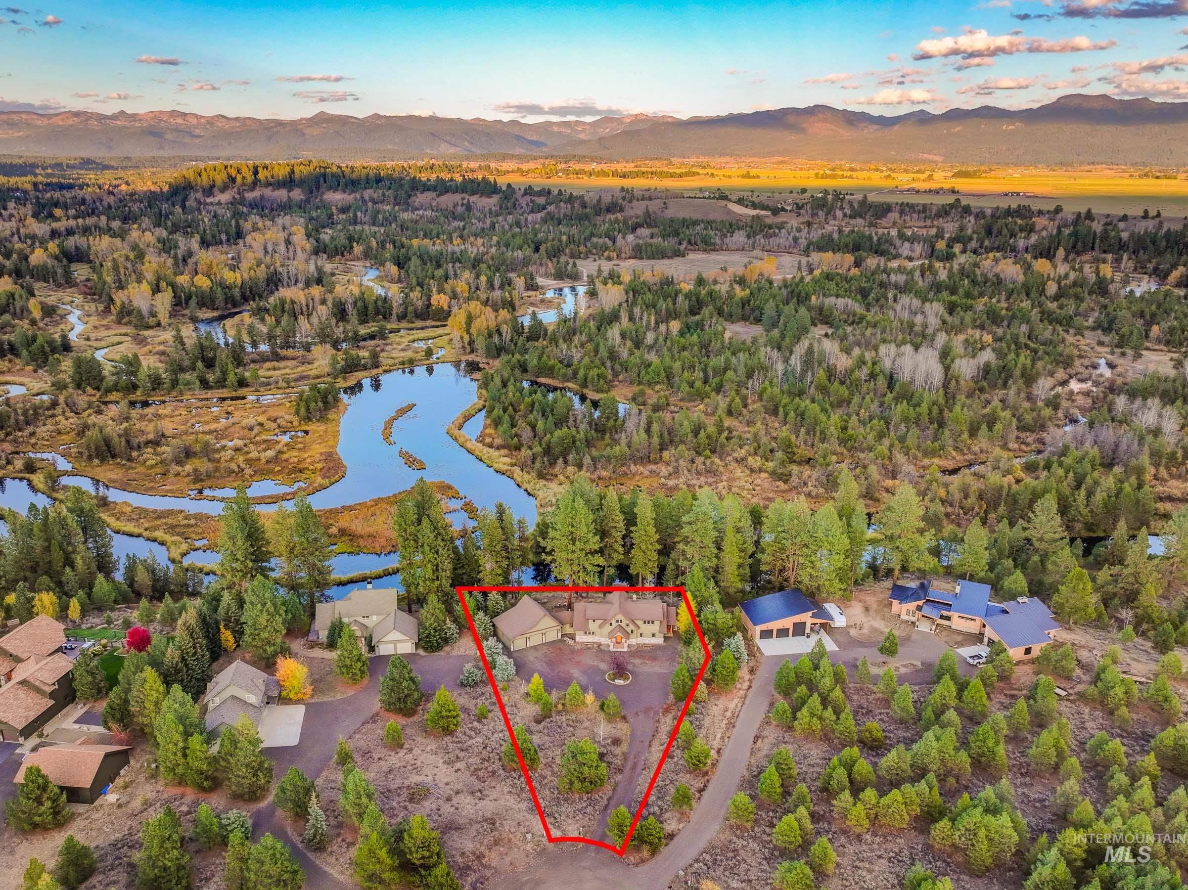 8 Bitterroot Court McCall, ID 83638 - Photo 43 of 50 Aerial view of property and surrounding area featuring property boundaries highlighted and a water and mountain view