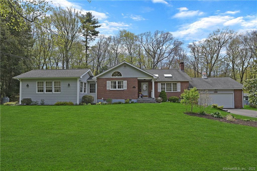 45 Sunnyridge Road Avon, CT 06001 - Photo 1 of 1 a front view of a house with a garden