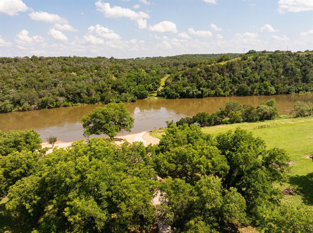 2105 River Shls Road Mineral Wells, TX 76067 - Photo 33 of 38 a view of a lake with houses in the back
