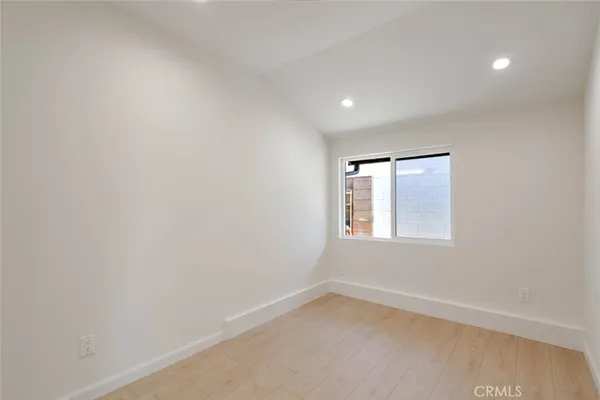 a bathroom with a toilet a sink and a mirror