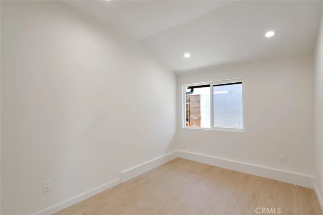a bathroom with a toilet a sink and a mirror