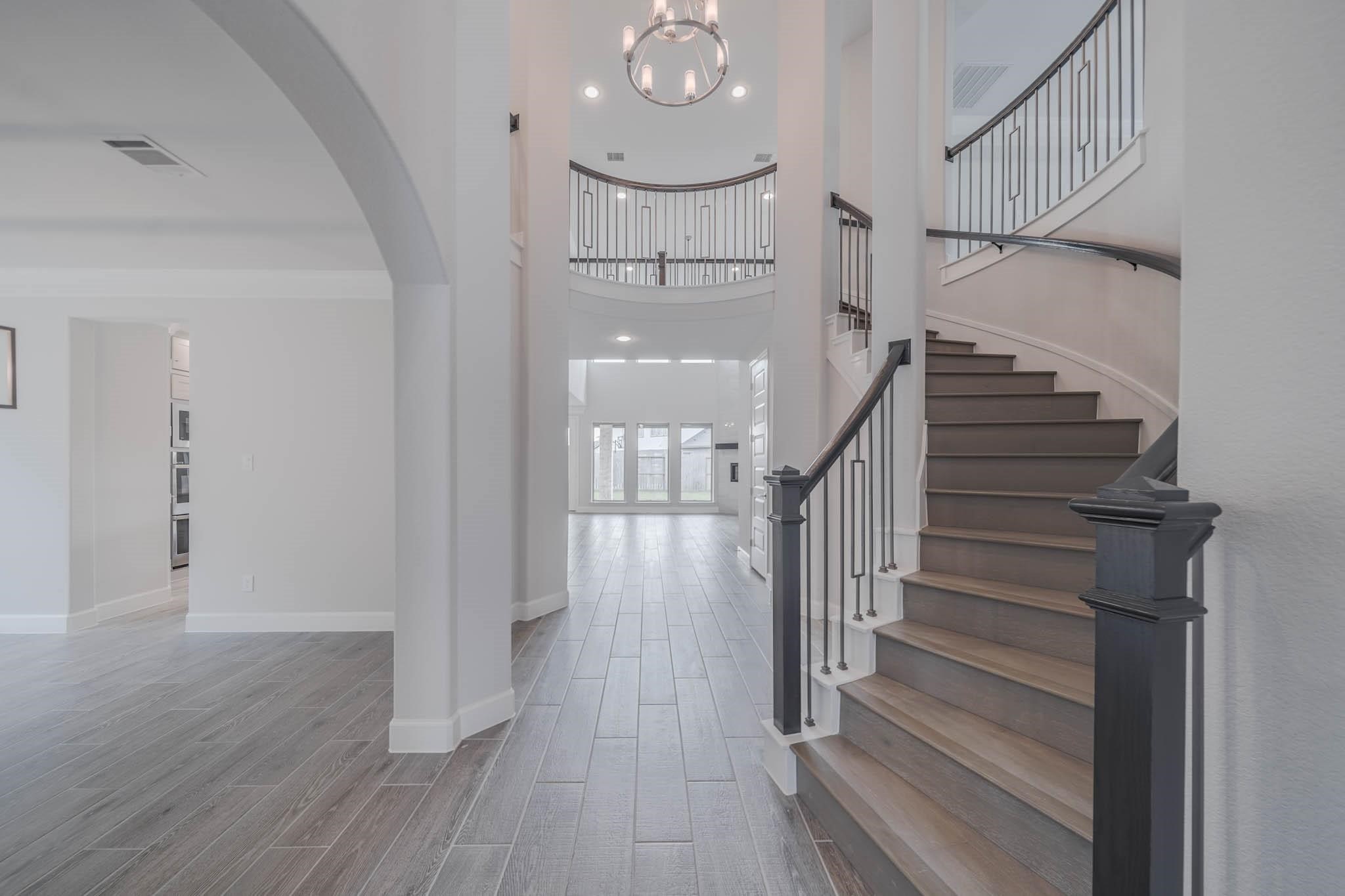 29103 Hauter Way Fulshear, TX 77441 - Photo 14 of 40 a view of entryway and hall with wooden floor