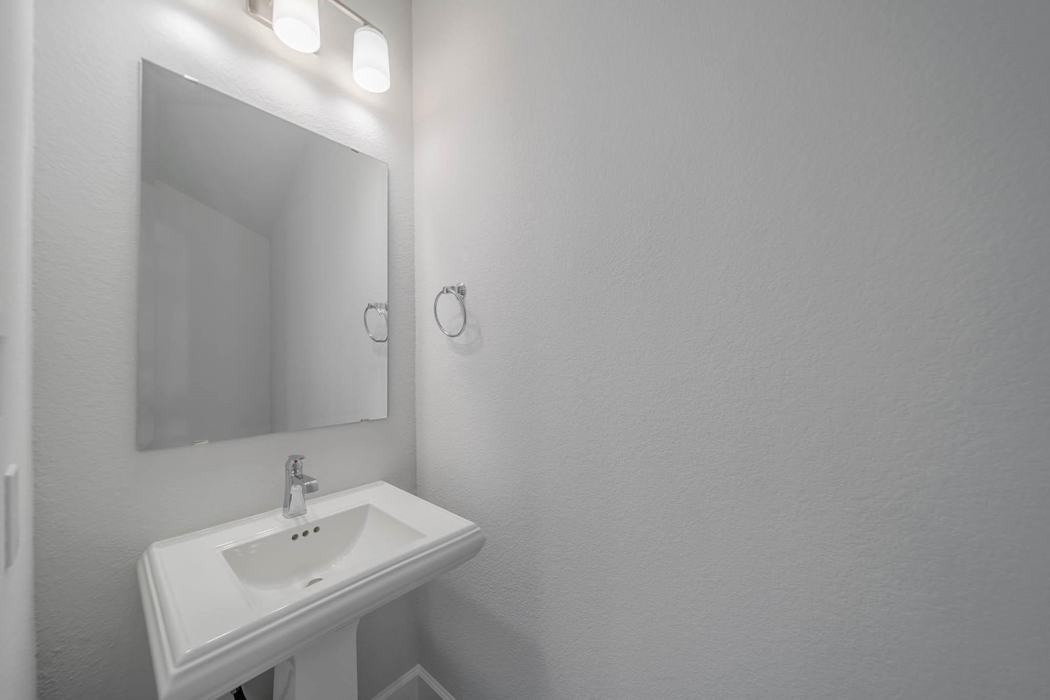 29103 Hauter Way Fulshear, TX 77441 - Photo 17 of 40 a bathroom with a sink and a mirror