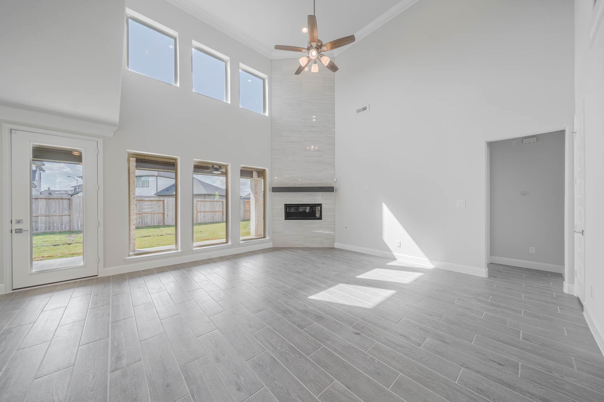 29103 Hauter Way Fulshear, TX 77441 - Photo 22 of 40 a view of empty room with wooden floor and fan