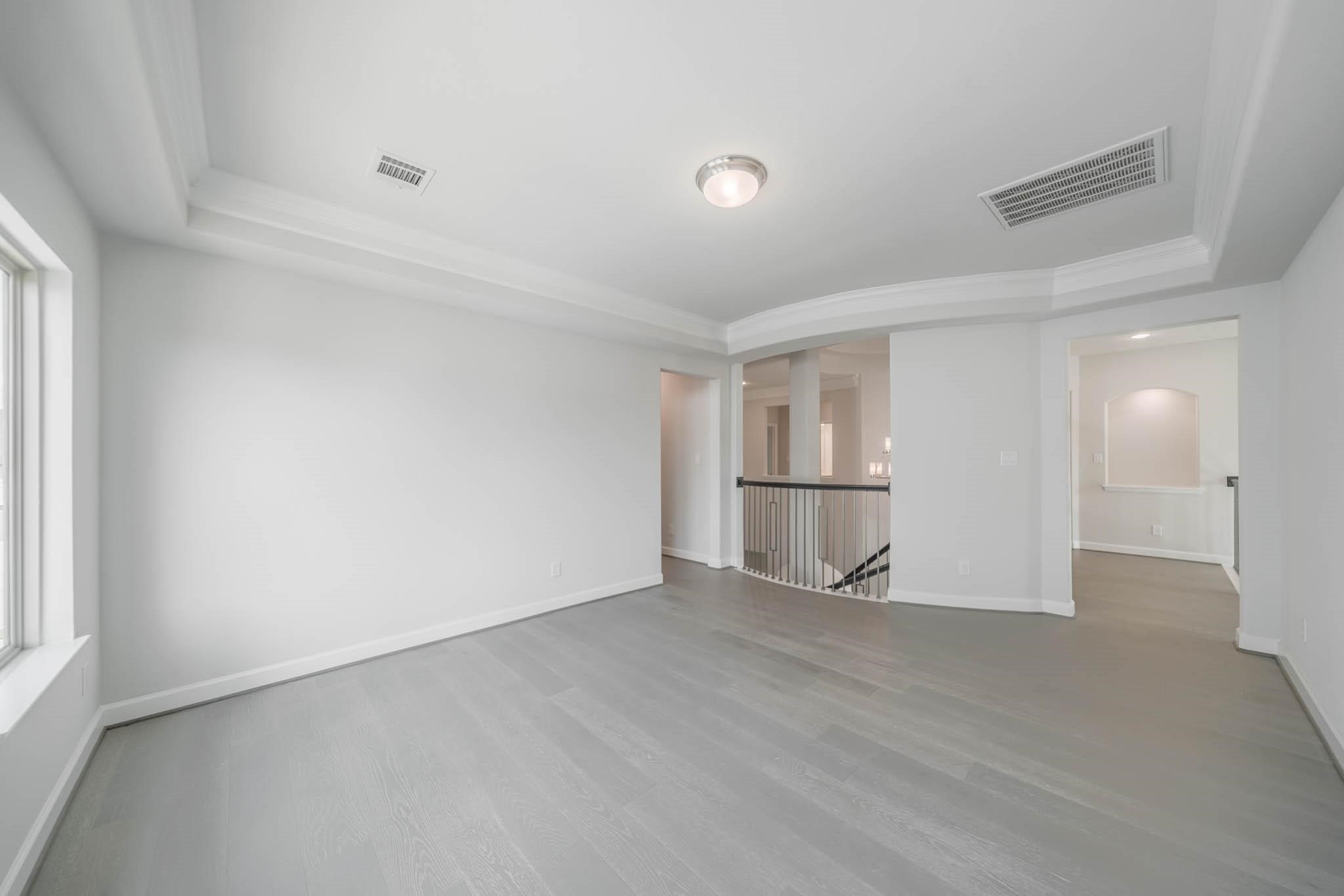 29103 Hauter Way Fulshear, TX 77441 - Photo 30 of 40 a view of empty room with wooden floor and window