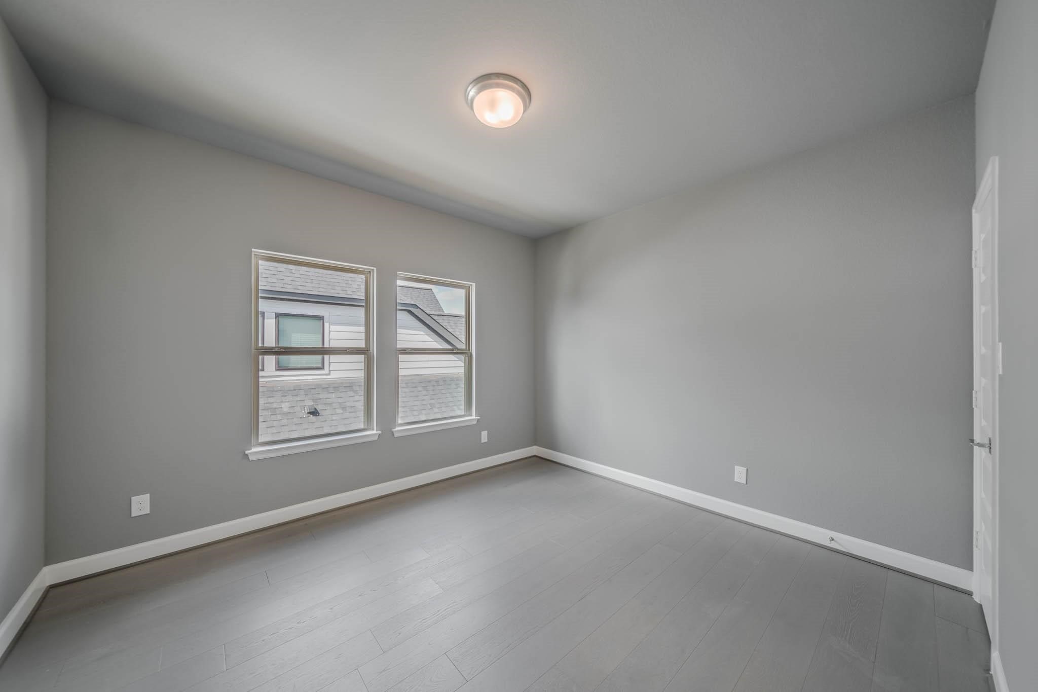 29103 Hauter Way Fulshear, TX 77441 - Photo 31 of 40 an empty room with windows and closet