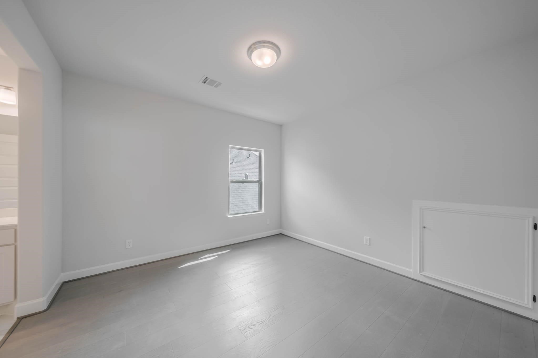 29103 Hauter Way Fulshear, TX 77441 - Photo 33 of 40 an empty room with a empty space and windows