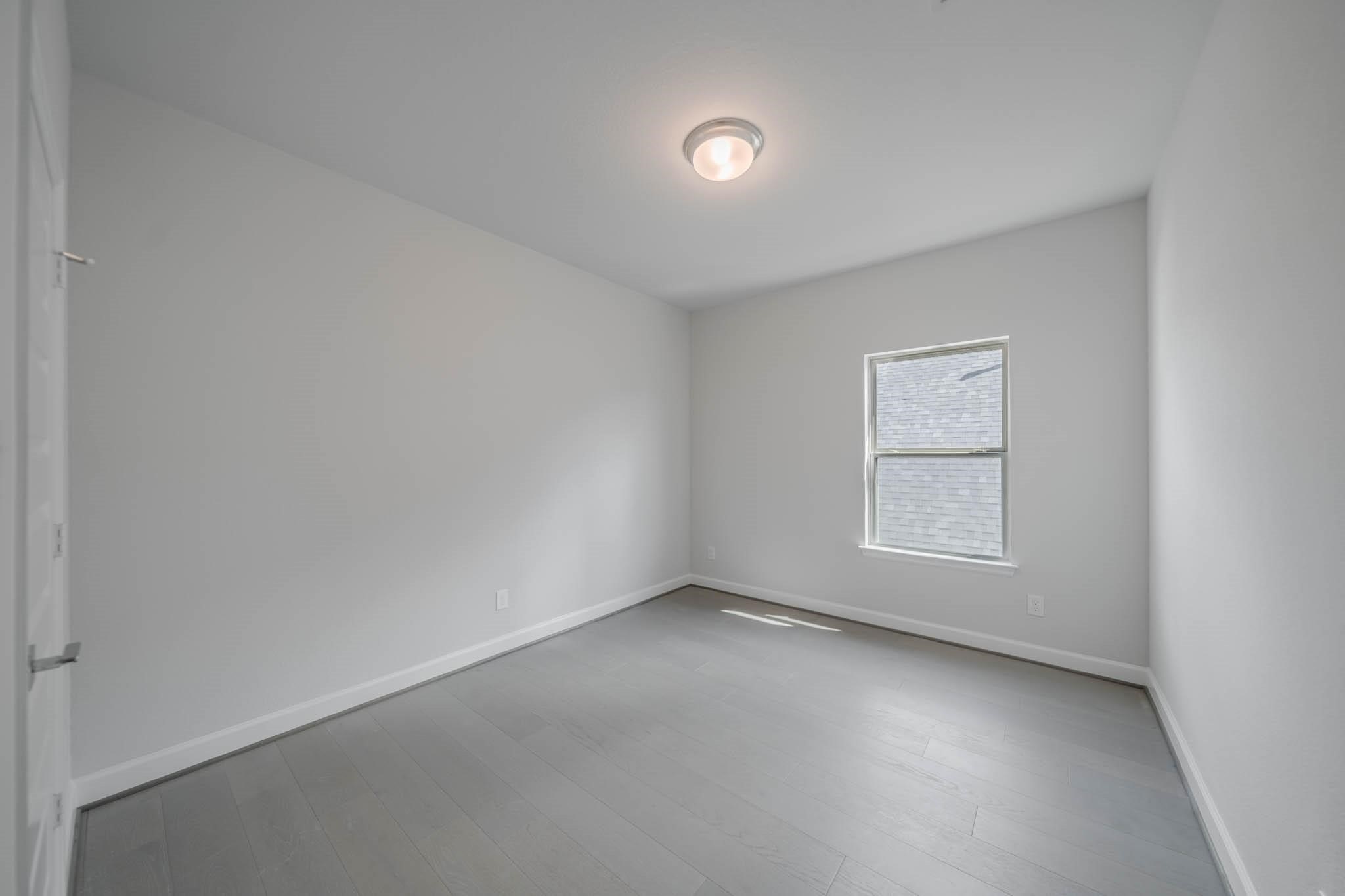 29103 Hauter Way Fulshear, TX 77441 - Photo 36 of 40 an empty room with a window