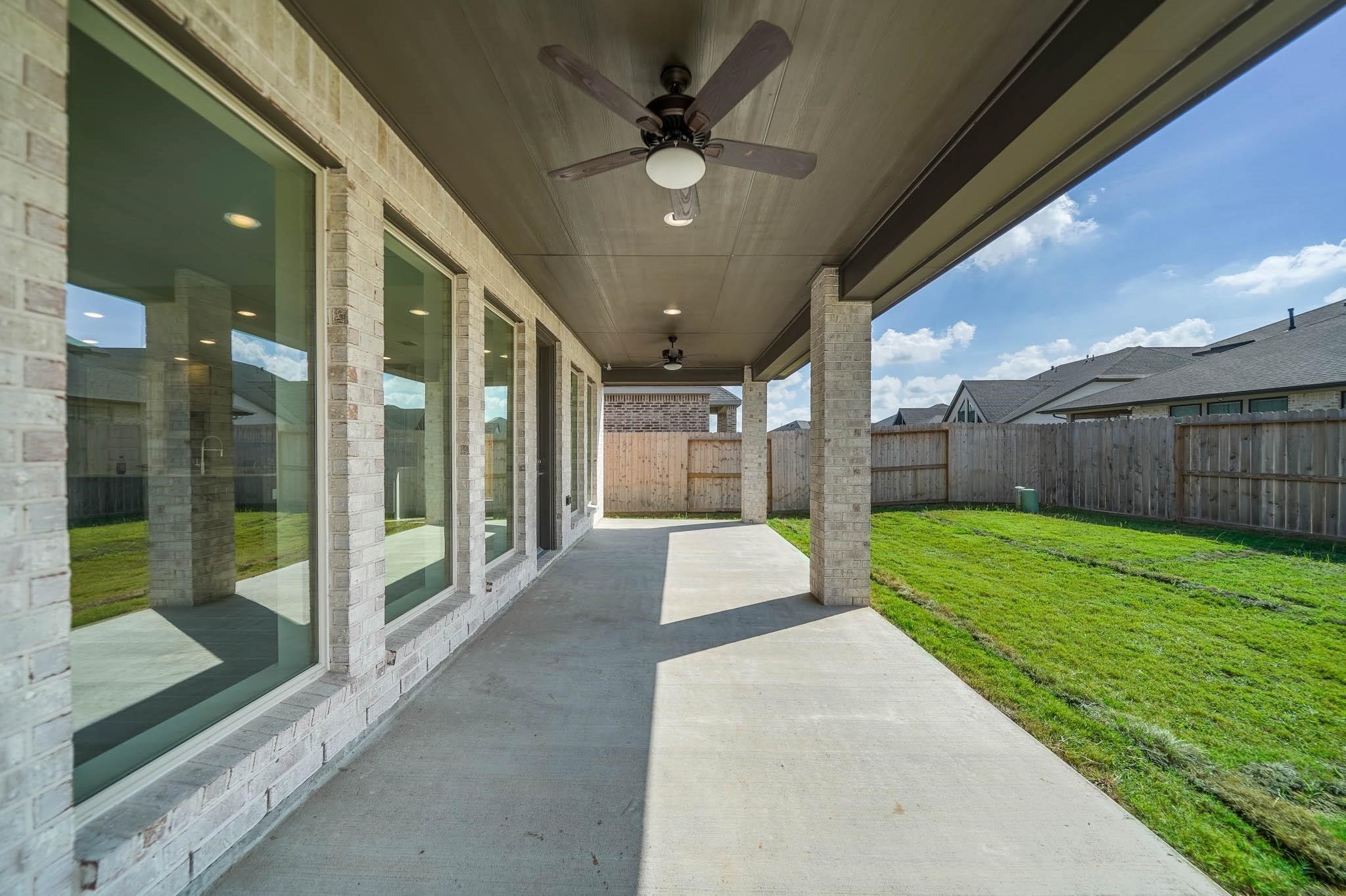 29103 Hauter Way Fulshear, TX 77441 - Photo 38 of 40 a view of a porch with a backyard