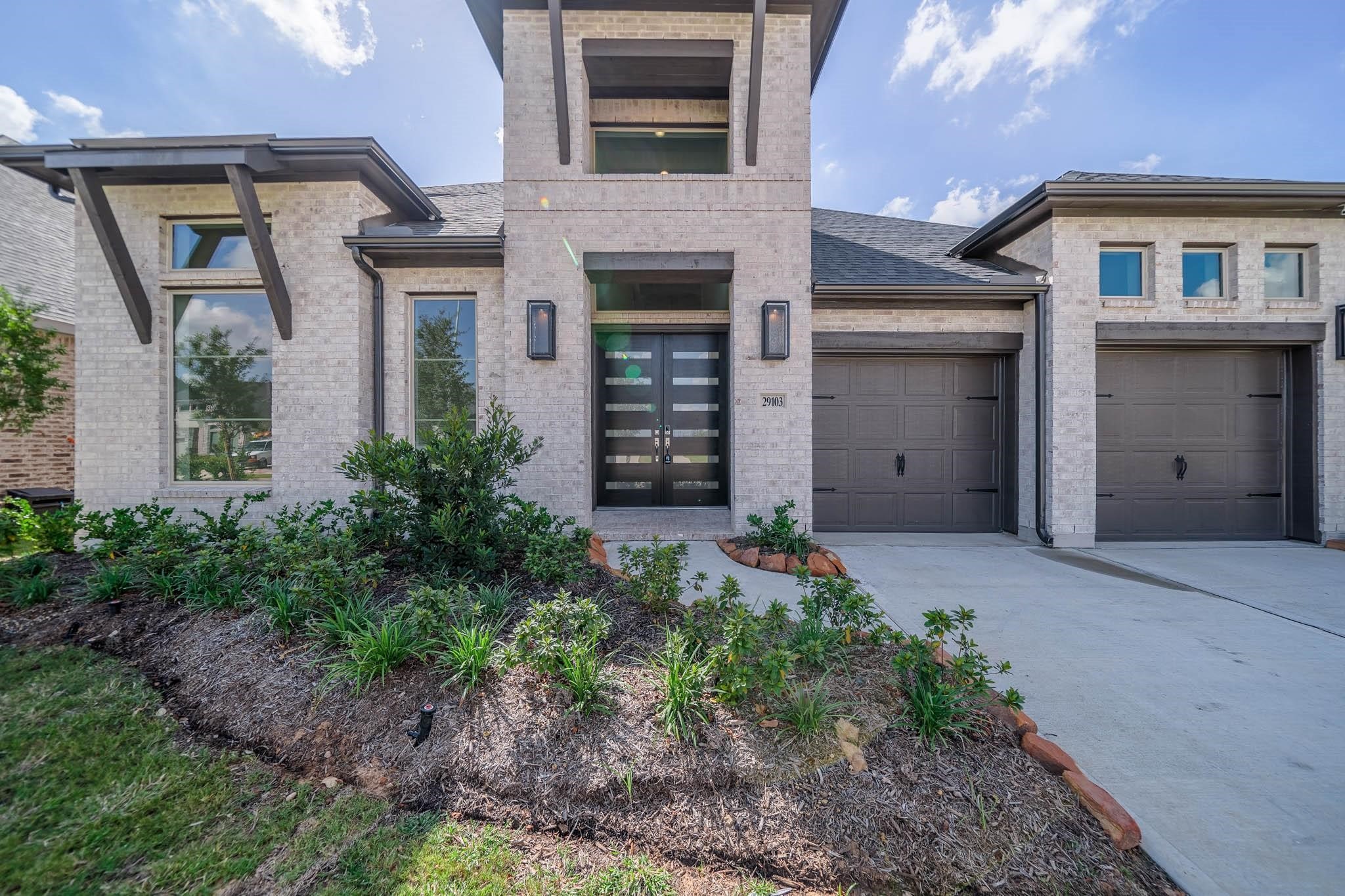 29103 Hauter Way Fulshear, TX 77441 - Photo 4 of 40 front view of a house with a yard