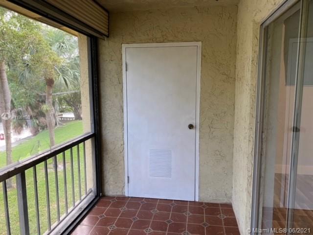 842 Southwest 9th St Circle, Unit 202 Boca Raton, FL 33486 - Photo 22 of 27 a view of empty room with windows