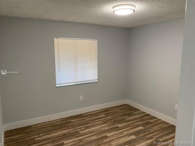 842 Southwest 9th St Circle, Unit 202 Boca Raton, FL 33486 - Photo 5 of 27 a view of empty room with wooden floor