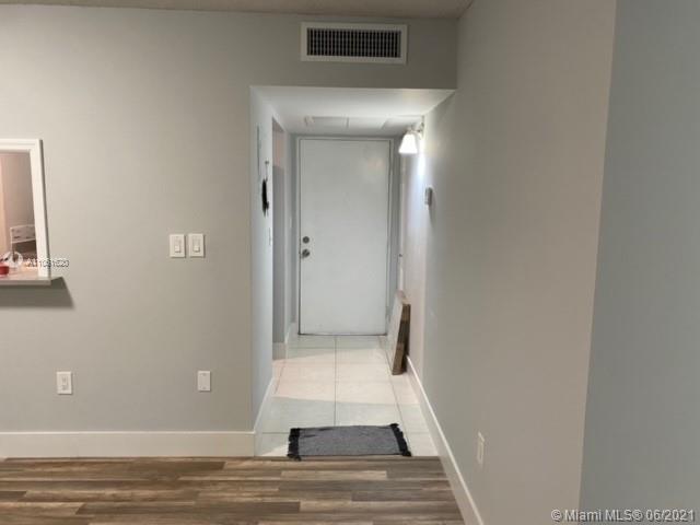 842 Southwest 9th St Circle, Unit 202 Boca Raton, FL 33486 - Photo 8 of 27 a view of entryway with wooden floor