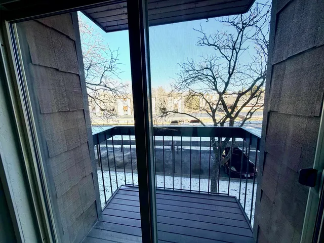 a view of balcony with wooden floor