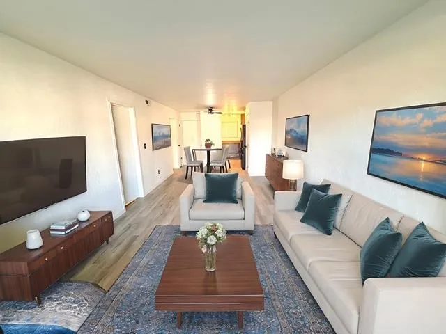 a living room with furniture and a flat screen tv