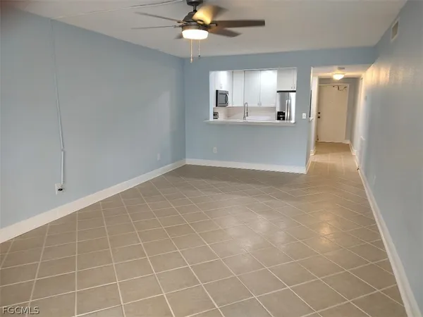 a view of a kitchen with a sink and a window